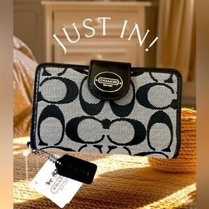 Coach cell phone case. Excellent. ** iPhone 4s not included**